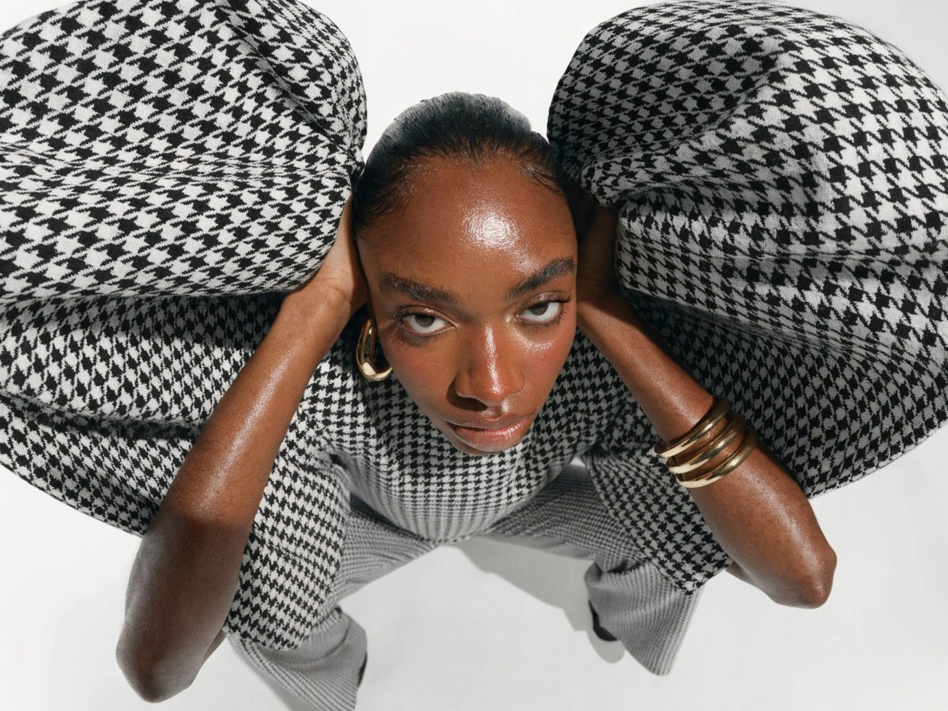 A patterned shirt beside a pair of neutral tailored trousers